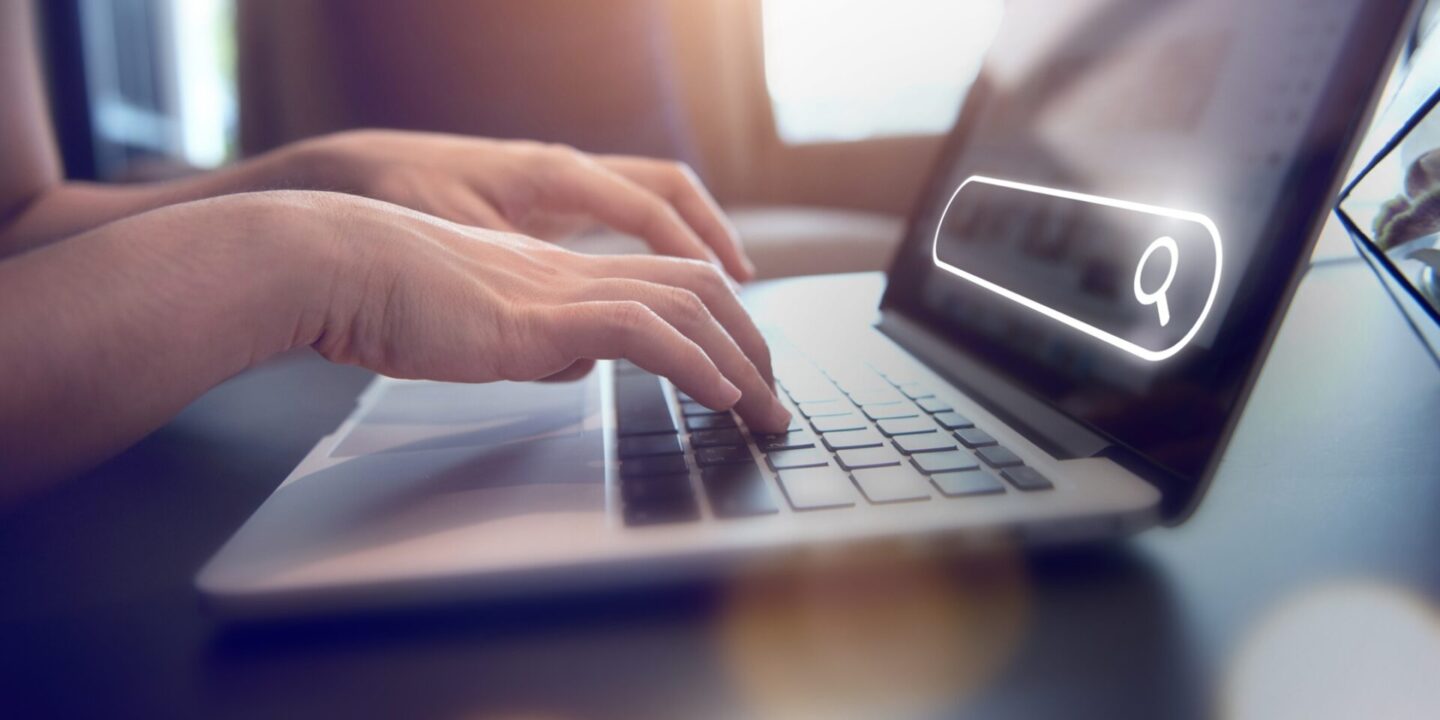 An image showing someone typing on a keyboard