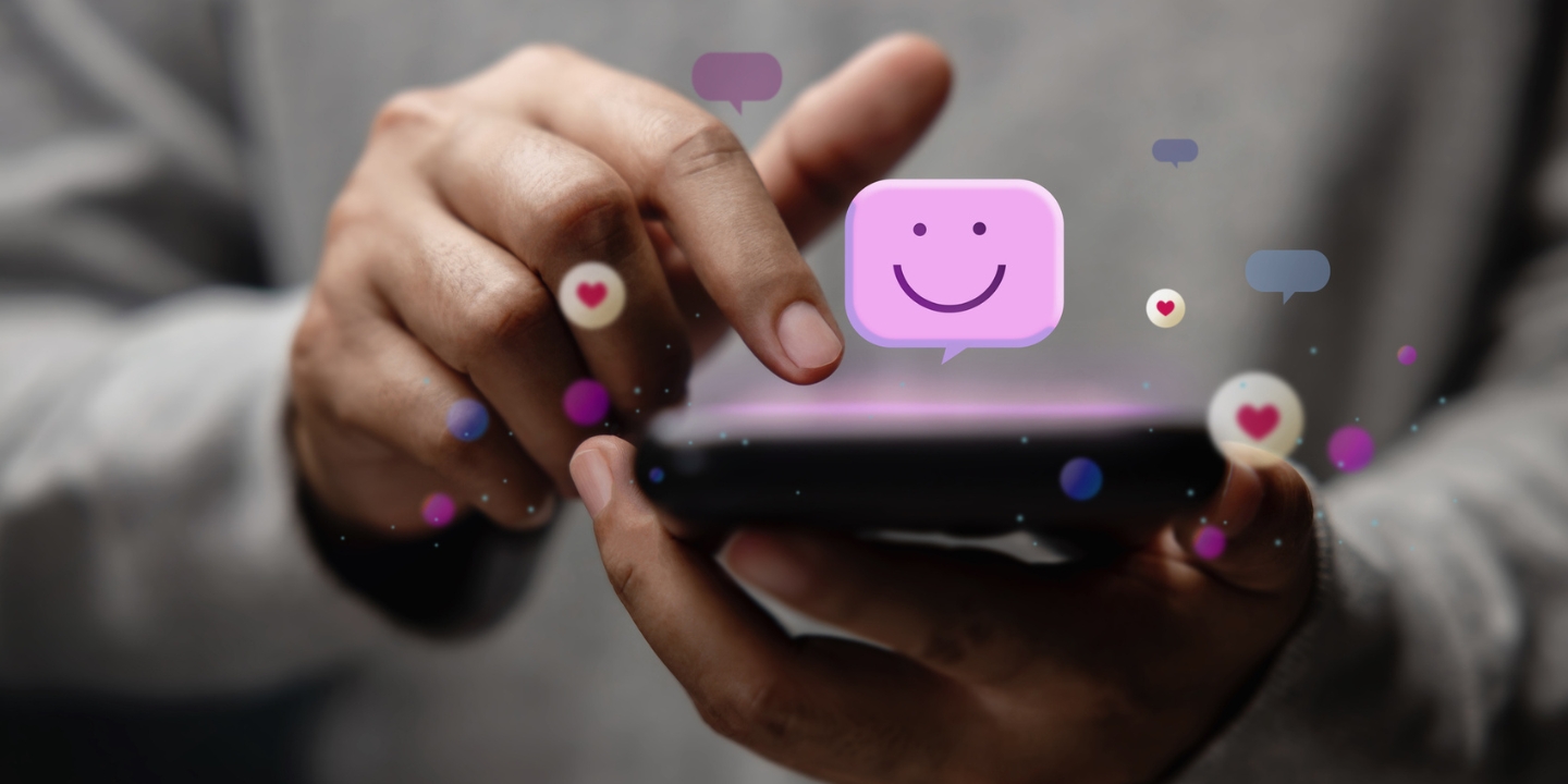 image showing a finger clicking a mobile phone and a smiley face